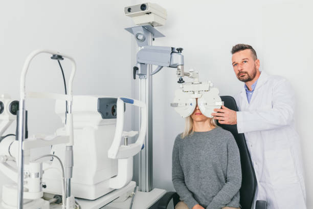 istock Eye doctor checking patient's eyes on a machine. 1067130538