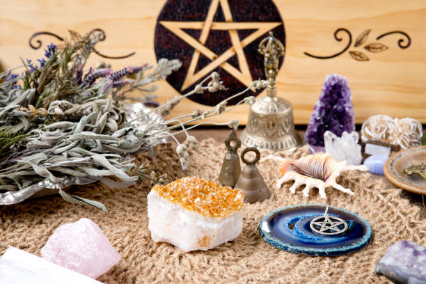 Witch Altar decorations - with pentacle, herbs and crystals Witch Altar decorations - with pentacle, herbs and crystals, with natural crotchet jute altar cloth crystal altar stock pictures, royalty-free photos & images