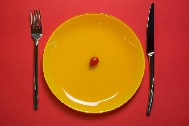 Fork, knife on red background