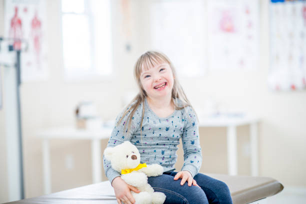 istock Girl with Down syndrome at doctor's office 1067140268