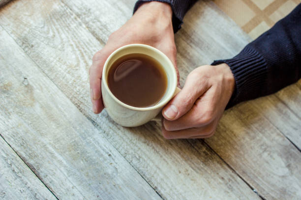 istock Tea in hand. The lovers are together. Selective focus. 1067140456