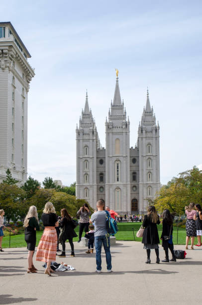 188th Semiannual General Conference of the Church in Salt Lake City, Utah. Salt Lake City, Utah, USA - October 6, 2018: Individuals and families from all over the world gather in Temple Square in the heart of Salt lake City, Utah for the 188th Semiannual General Conference of the Church of Latter Day Saint. The Conference is held biannually every April and October at the Conference Center in Salt Lake City, Utah. During each conference, members of the church gather in a series of two-hour sessions to listen to sermons from church leaders. Originating from Salt Lake City, General Conference is considered an international event for the church. The sessions are broadcast worldwide in over 90 languages and over the Internet. mormon woman photos stock pictures, royalty-free photos & images
