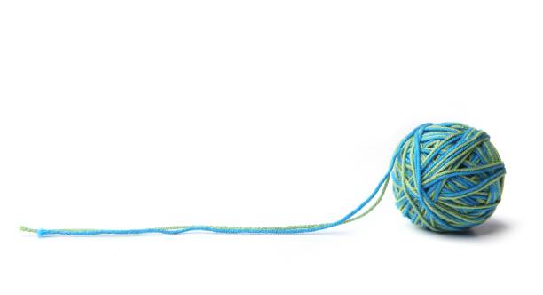 istock Colorful cotton thread ball from two color green and blue thread  isolated on white background. 1067148996