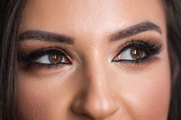 istock Woman wearing professional make-up 1067149156