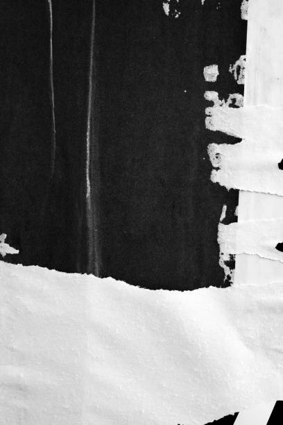 istock Blank white black old ripped torn paper crumpled creased posters grunge textures backdrop backgrounds placard 1067149964