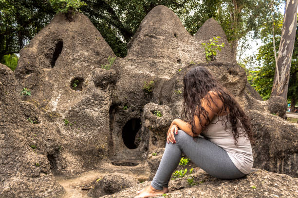 istock woman sitting on stones 1067150410