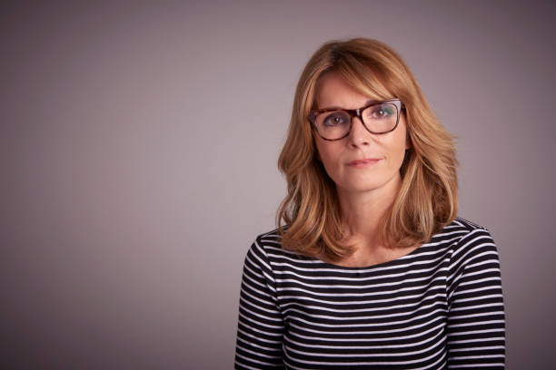 istock Confident middle aged woman studio portrait 1067151788
