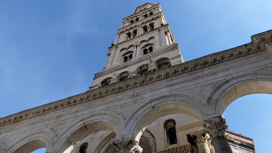 Diocletians Palace in Split, Croatia. Looking up at the Bell Tower to teh blue sky