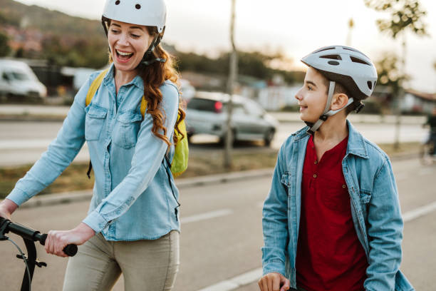 istock Mother and son drive scooter 1067153222