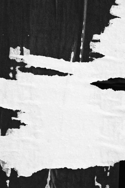 istock Blank white black old ripped torn paper crumpled creased posters grunge textures backdrop backgrounds placard 1067155310