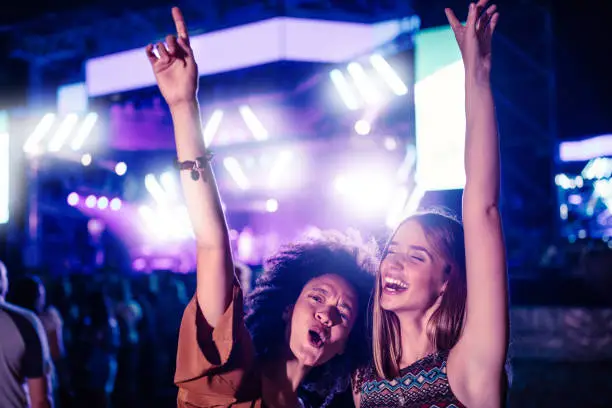 Two young women having fun at a music festival