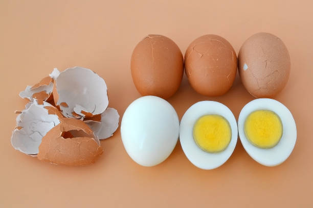istock Five hard boiled brown chicken eggs on brown background 1067171758