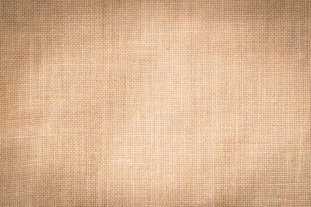 istock Hessian sackcloth woven texture pattern background in light cream beige brown color 1067172014