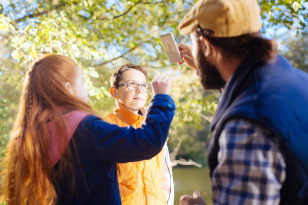 istock Nice red haired girl looking at the special device 1067174448