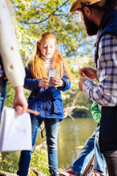 istock Cute pretty girl holding a special device 1067174474