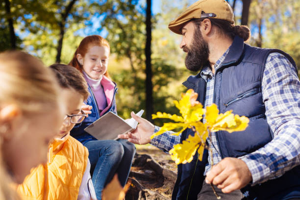 istock Nice positive man looking at the notes of his pupil 1067174694