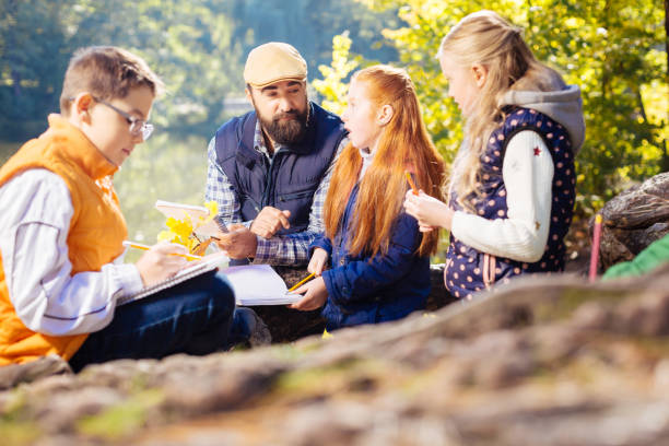 istock Smart positive kids asking questions to their teacher 1067174808