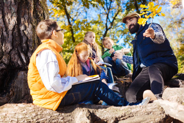 istock Positive bearded man holding a branch in front of him 1067174822