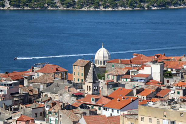 Historic city centre of Sibenik, Croatia with the dome of the Cathedral of St. James, famous UNESCO World Heritage Site. Adriatic Sea in the background. View from the Barone Fortress.
