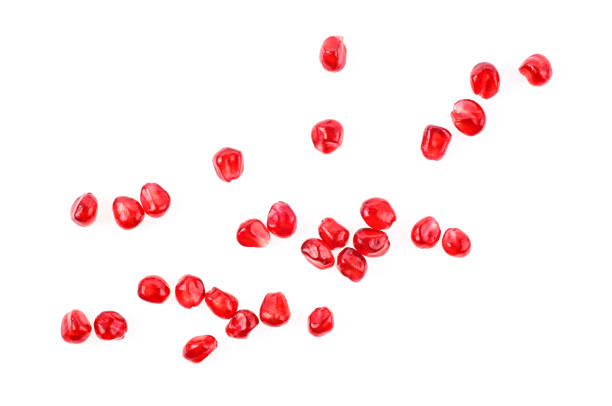 istock Pomegranate seeds on a white background 1067176612