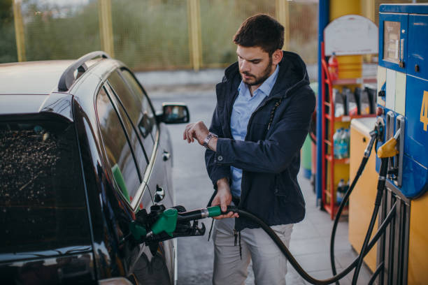 istock Man pouring fuel in vehicle 1067177056