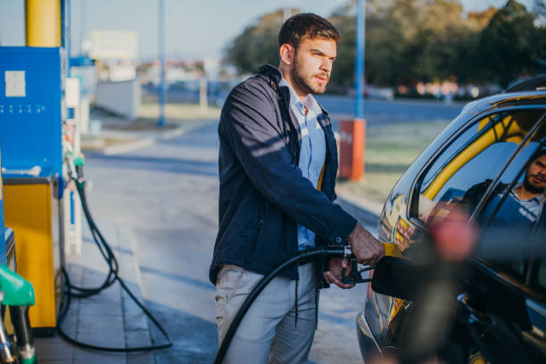 istock Guy pouring fuel in vehicle 1067177074