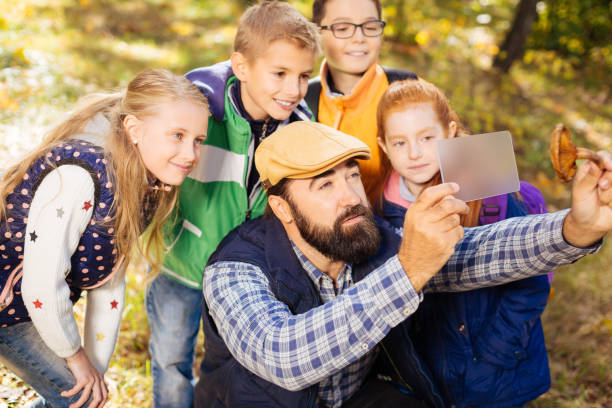 istock Positive smart children looking at the tablet screen 1067177104