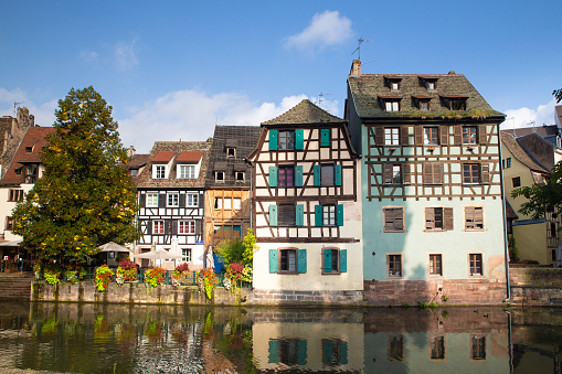 view on historic Marburg over Lahn river at blue summer morning with weir in the foreground and castle in the background