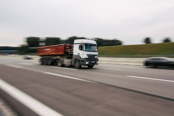istock Blurred motion truck moving with high speed 1067181120