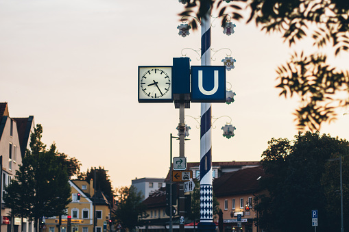 Munich U-Bahn station sign with stylish clock and vintage effect