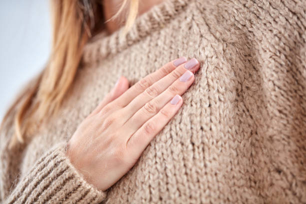 istock Young woman with heart problem holding chest. 1067181404