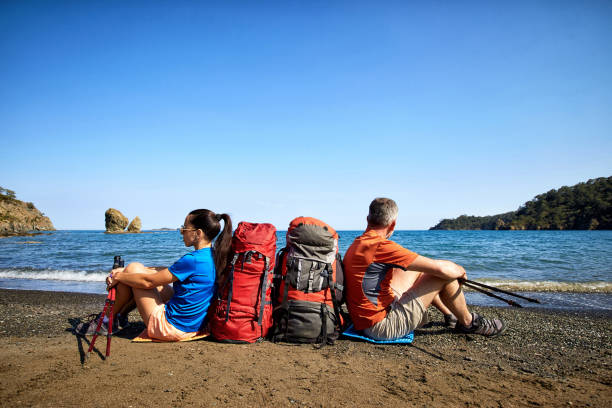istock Adventure trek along the coast with a backpack in the summer. 1067189886