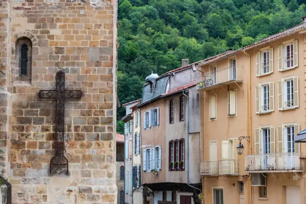 Church cross and houses in the Villa de Foix near the Pyrenees and Andorra. Ariege France