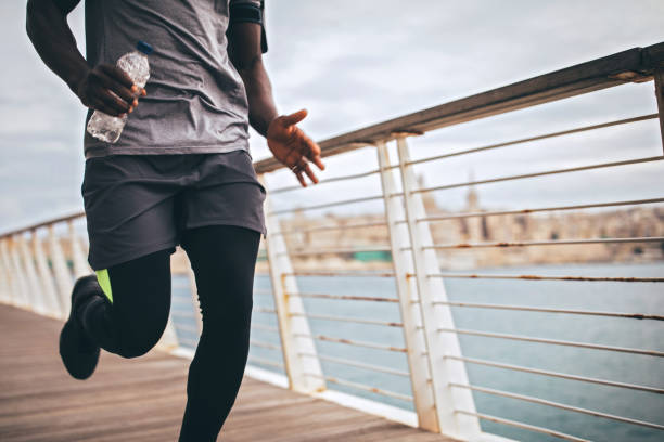 istock Young Man Running Outdoors 1067192260