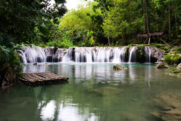 istock waterfall and bamboo raft in the stream 1067193772