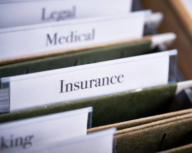 istock INSURANCE: Files and folders in desk drawer with labels and tabs: Home office management 1067194084