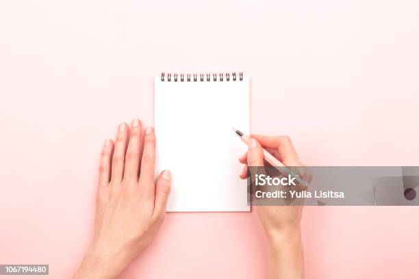 Woman Hands And A Notepad Stock Photo - Download Image Now - Writing - Activity, Handwriting, Hand