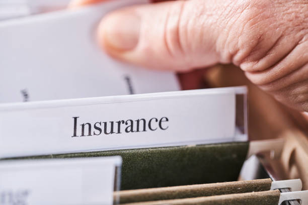 istock INSURANCE: Files and folders in desk drawer with labels and tabs: Home office management 1067194538