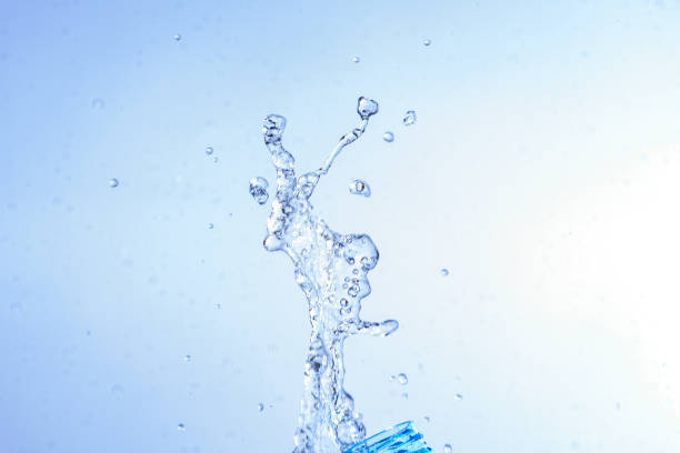 istock Bottle opening with water splashing isolated on white background. 1067198866