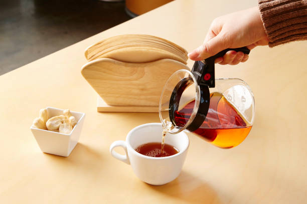 istock Pouring coffee on a wooden table 1067199294