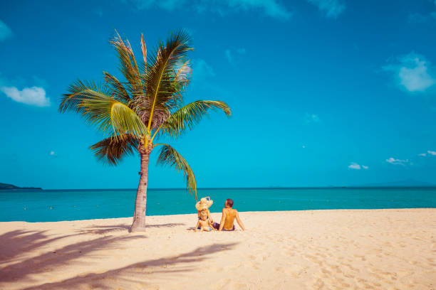 istock Family sitting at the beach 1067203322