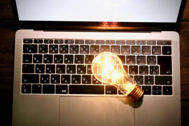 istock Laptop computer and bulb / business concept 1067205210
