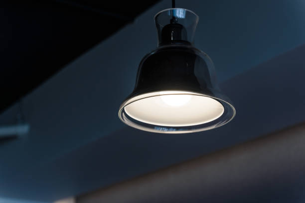 istock modern lamp hanging from the ceiling with copy space. Dark Tone 1067210760
