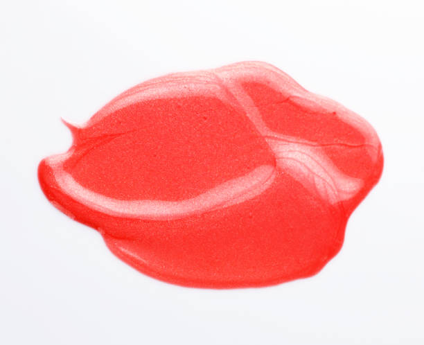 istock Texture of the Red Lipgloss liquid, white background 1067216560