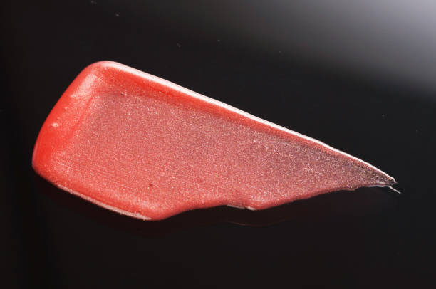 istock Texture of Red Lipgloss Liquid, Black Background 1067216570