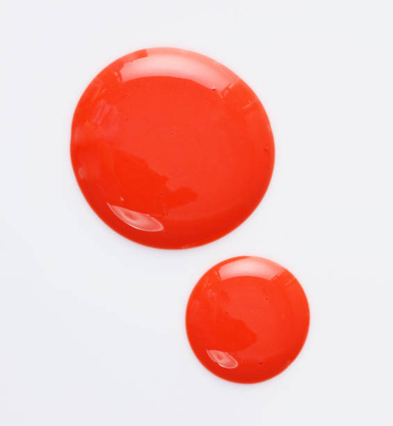 istock Texture of the Red Lipgloss liquid, white background 1067216584