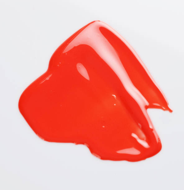 istock Texture of the Red Lipgloss liquid, white background 1067216590