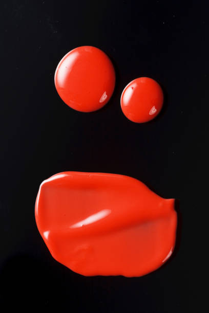 istock Texture of Red Lipgloss Liquid, Black Background 1067216658