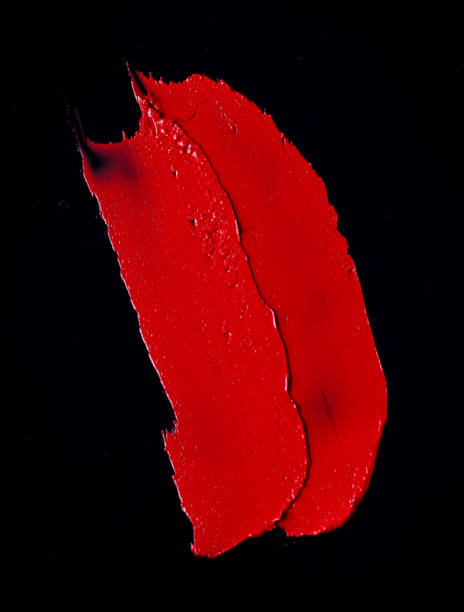 istock the texture of red lipstick Black background 1067216820