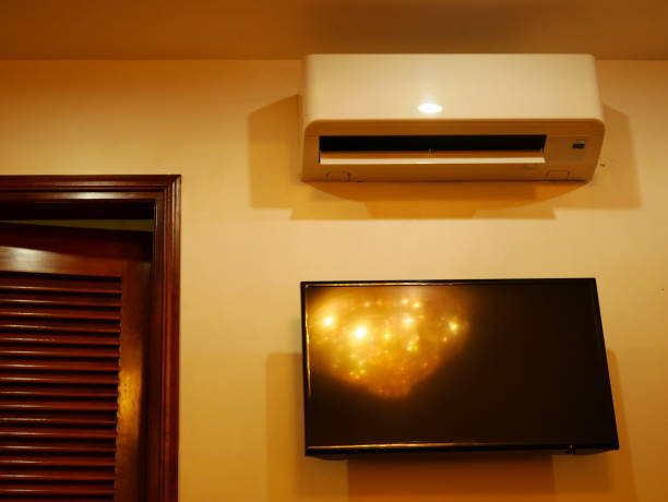 istock Air Conditioner on wall and display LED TV 1067236648